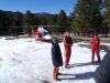 Volunteers training in conjunction with helicopter.